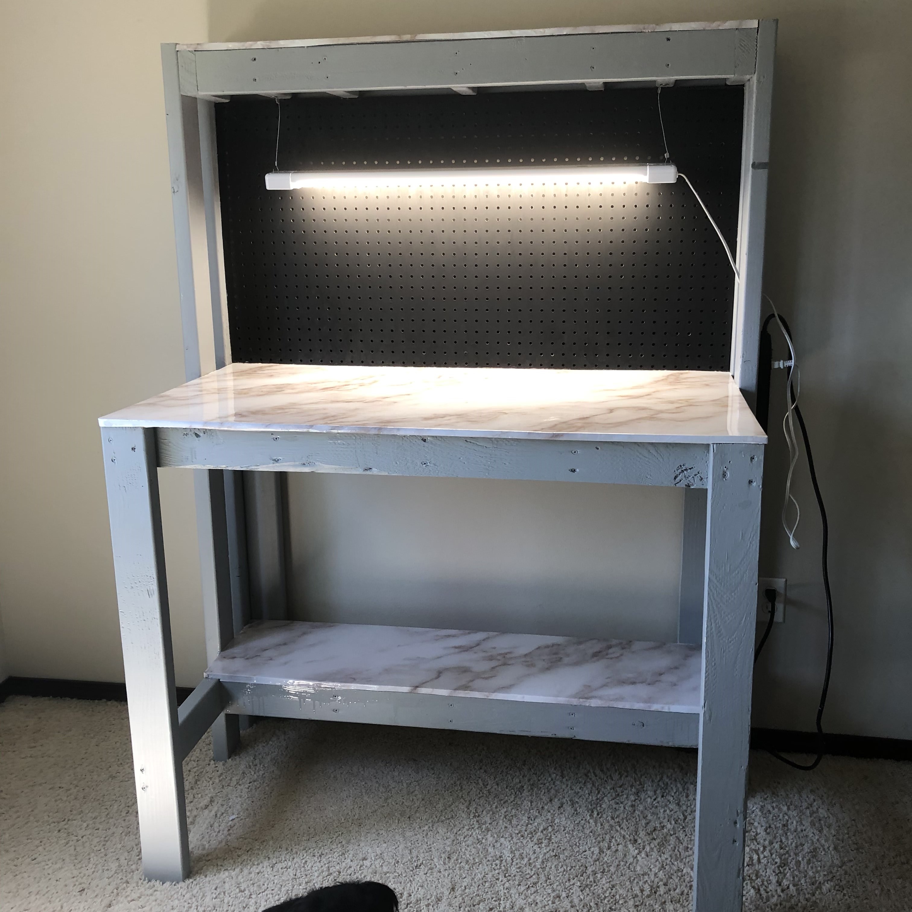 handmade wooden desk with marble contact paper detailing and led lights