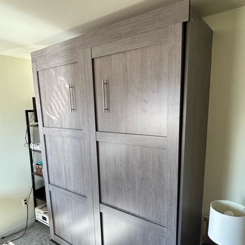 wooden murphy bed assembeled from kit in the closed position